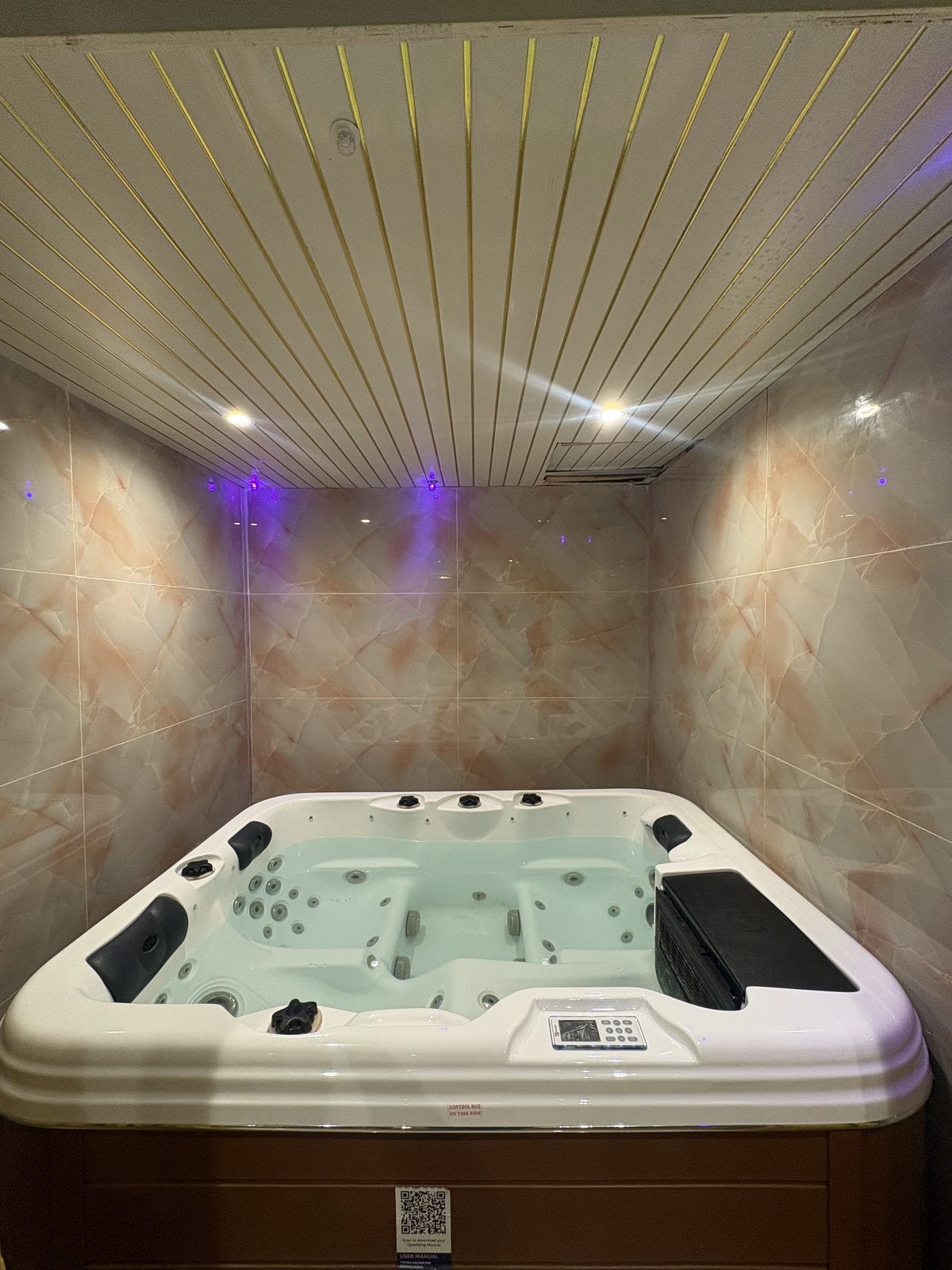 Private Jacuzzi in a marble-tiled alcove