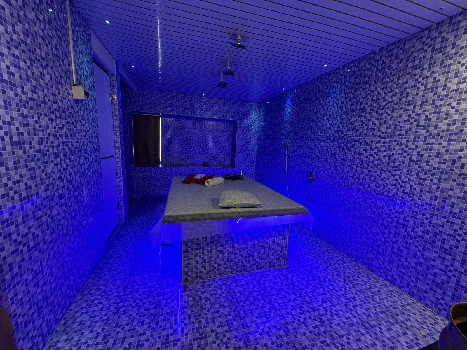 Hammam treatment room in deep blue light