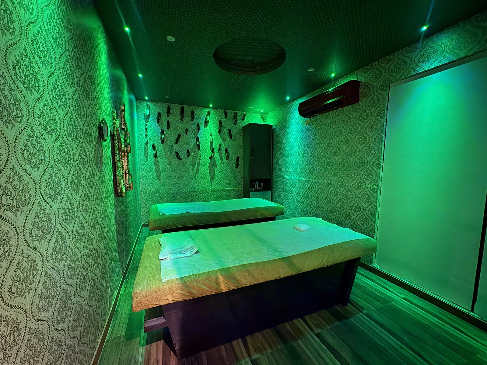 Twin massage beds in a private couple suite